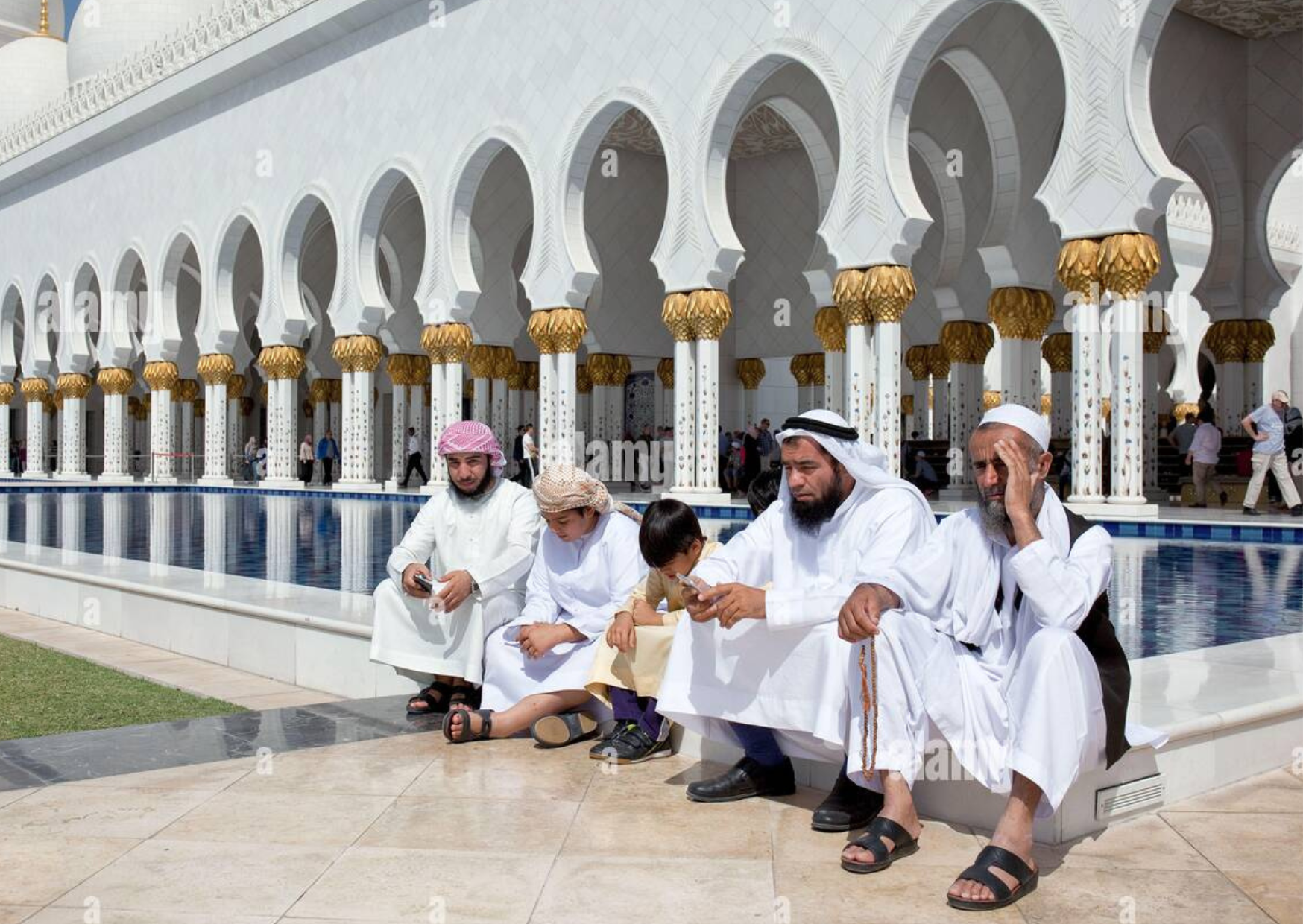  men in kandura in a mosque